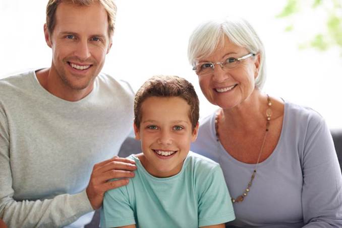 Grandmother with Son and Grandson Smiling at Camera